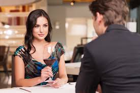 girl on date with glass of wine